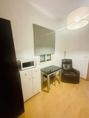 Una cocina o zona de cocina en Apartamentos Jamé Mérida