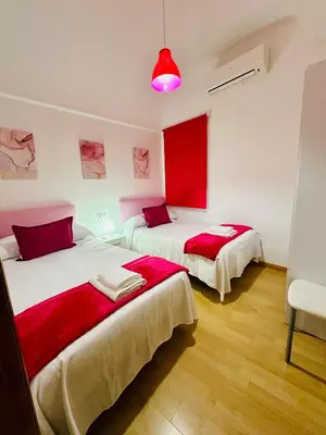 Cama o camas de una habitación en Apartamentos Jamé Mérida