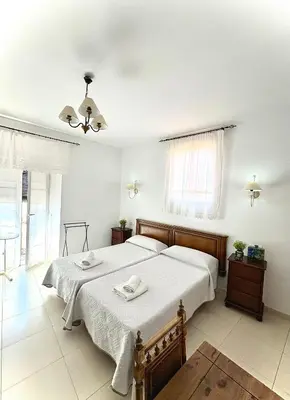 Cama o camas de una habitación en Casa Rural la Plaza