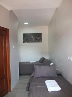 Cama o camas de una habitación en Los Angeles Plaza