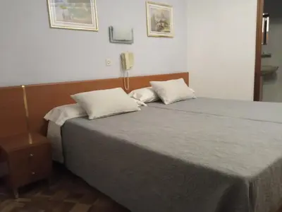 Cama o camas de una habitación en Hostal Cuzco