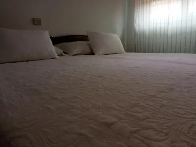 Cama o camas de una habitación en Hostal Cuzco