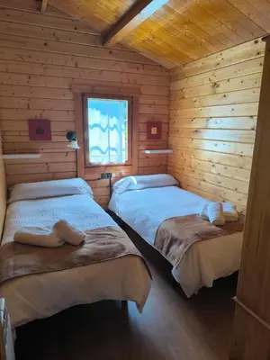 Cama o camas de una habitación en Cabañas Miraduero