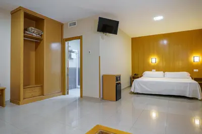 Cama o camas de una habitación en Hostal Acueducto Los Milagros