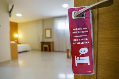 Cama o camas de una habitación en Hostal Acueducto Los Milagros