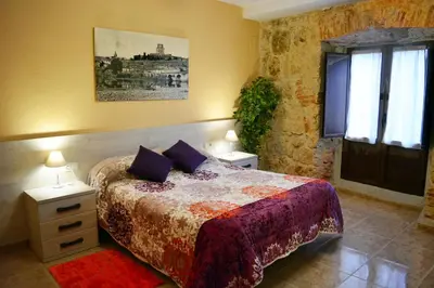 Cama o camas de una habitación en Apartamento Palacio Antigua Audiencia