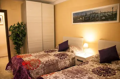 Cama o camas de una habitación en Apartamento Palacio Antigua Audiencia