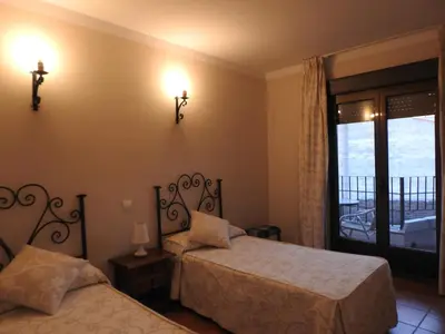 Cama o camas de una habitación en La Posada de Bayuela