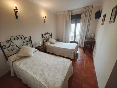 Cama o camas de una habitación en La Posada de Bayuela