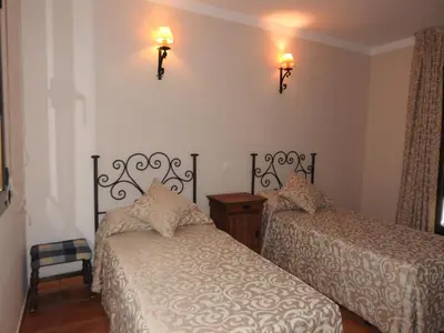 Cama o camas de una habitación en La Posada de Bayuela