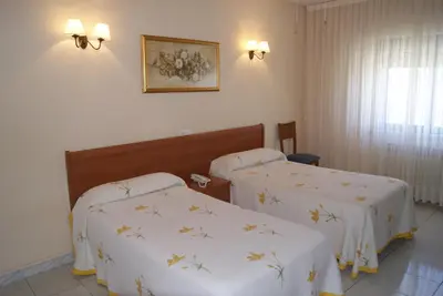 Cama o camas de una habitación en Hotel Alameda