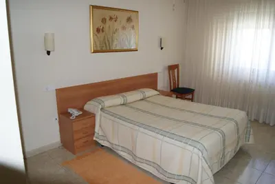 Cama o camas de una habitación en Hotel Alameda