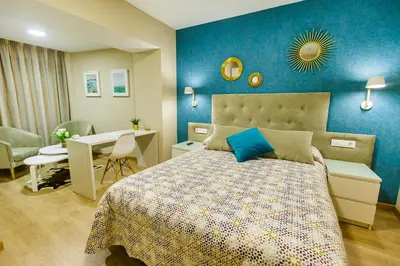 Cama o camas de una habitación en Hospedería Castilla Plaza Mayor