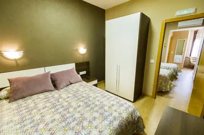 Cama o camas de una habitación en Hospedería Castilla Plaza Mayor
