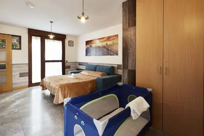 Cama o camas de una habitación en +Homes | El Patio de la Catedral