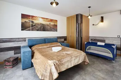 Cama o camas de una habitación en +Homes | El Patio de la Catedral