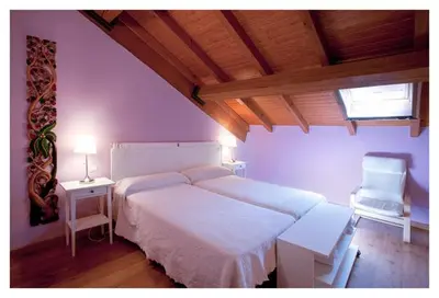 Cama o camas de una habitación en Hotel Balneario Almeida Dama Verde