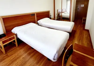 Cama o camas de una habitación en Hotel Los Barruecos by Croma