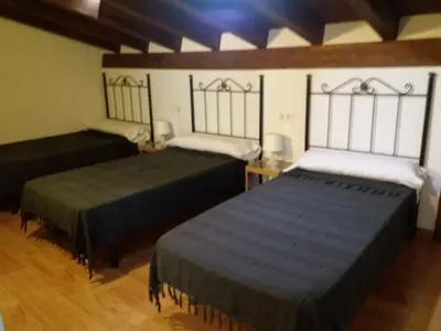 Cama o camas de una habitación en La Casa de Mi Abuela