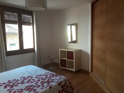 Cama o camas de una habitación en Apartamentos y Estudios LA RISTRA
