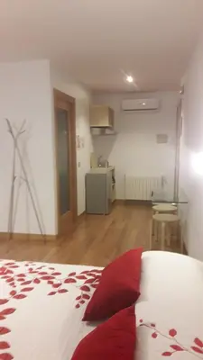 Cama o camas de una habitación en Apartamentos y Estudios LA RISTRA