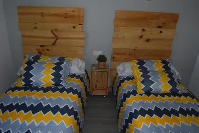 Cama o camas de una habitación en Apartamentos Rurales el Trillo
