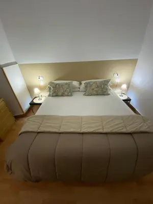 Cama o camas de una habitación en Apartamentos Caceres