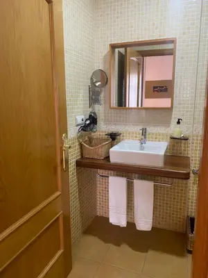Un baño de Apartamentos Caceres
