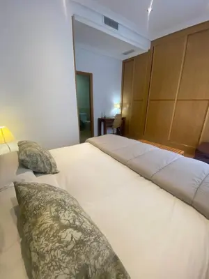 Cama o camas de una habitación en Apartamentos Caceres