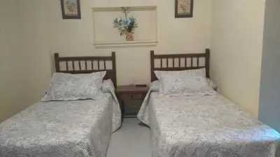 Cama o camas de una habitación en Hostal Alameda