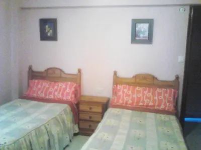 Cama o camas de una habitación en Hostal Alameda