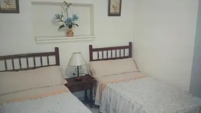 Cama o camas de una habitación en Hostal Alameda
