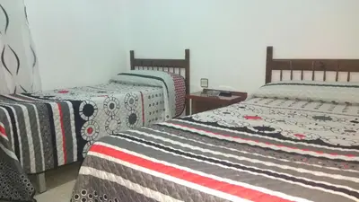 Cama o camas de una habitación en Hostal Alameda