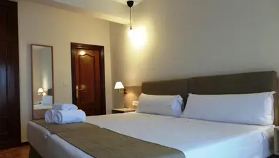 Cama o camas de una habitación en Hotel Puerta Ciudad Rodrigo