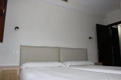 Cama o camas de una habitación en Apartamentos de Astroturismo la Cañada
