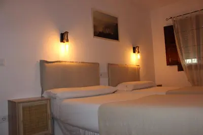 Cama o camas de una habitación en Apartamentos de Astroturismo la Cañada