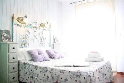 Cama o camas de una habitación en Habitaciones y casa rural monfrague
