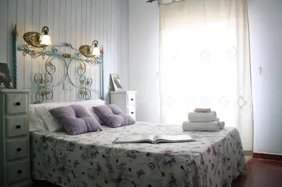 Cama o camas de una habitación en Habitaciones y casa rural monfrague