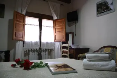 Cama o camas de una habitación en Habitaciones y casa rural monfrague