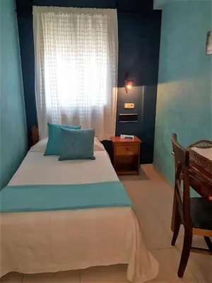 Cama o camas de una habitación en Hotel Carvajal