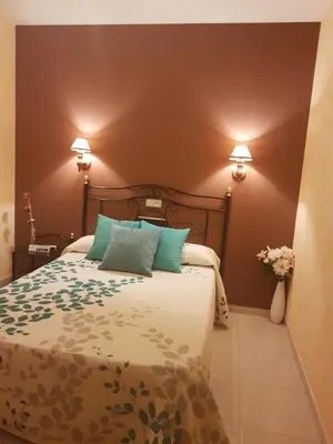 Cama o camas de una habitación en Hotel Carvajal