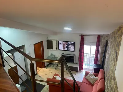 Una televisión o centro de entretenimiento en Apartamento Arco del Cristo