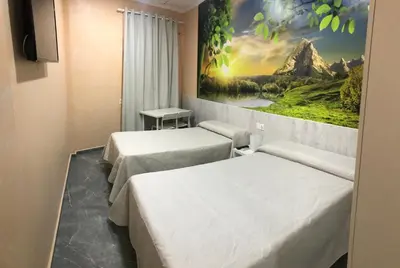 Cama o camas de una habitación en Hostal Kavanna