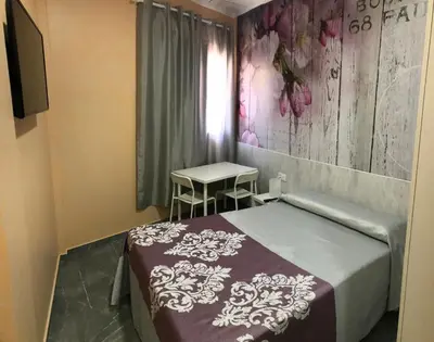 Cama o camas de una habitación en Hostal Kavanna