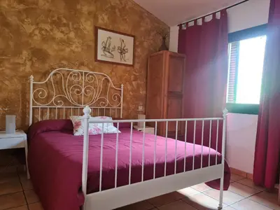Cama o camas de una habitación en Apartamentos Rurales Candela