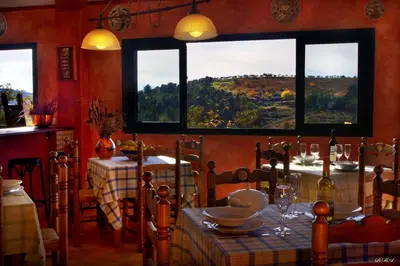 Un restaurante o sitio para comer en Apartamentos Rurales Candela