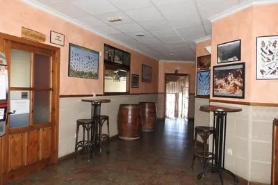 Una televisión o centro de entretenimiento en Casa Rural Monfragüe