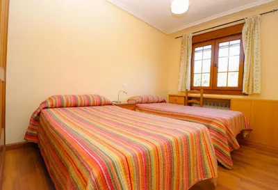Cama o camas de una habitación en Apartamentos El Retiro del Mirador by RetiroRural