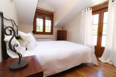Cama o camas de una habitación en Apartamentos El Retiro del Mirador by RetiroRural