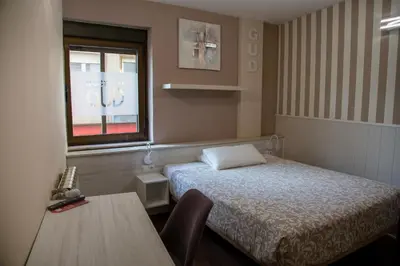 Cama o camas de una habitación en Hostal Gud Salamanca